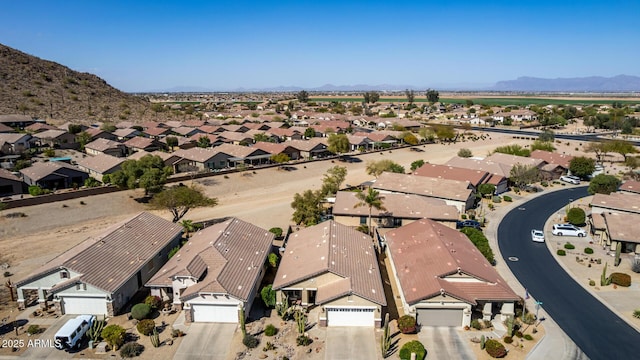 birds eye view of property with a mountain view and a residential view