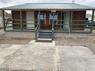 445 N Kilbright Ave, Ajo, AZ 85321 - view of front of property with an outbuilding, covered porch, and metal roof