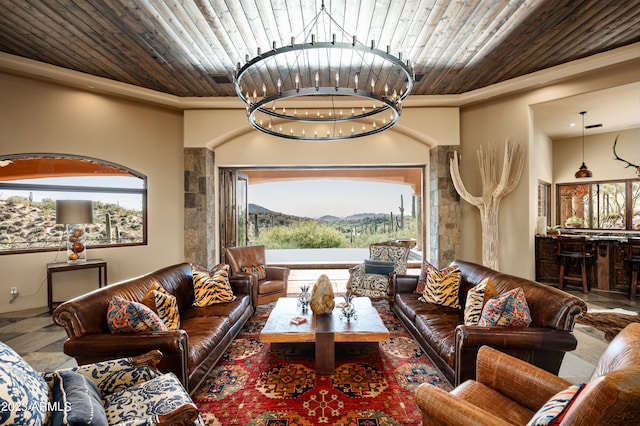 living room with dark tile flooring, a chandelier, and wooden ceiling