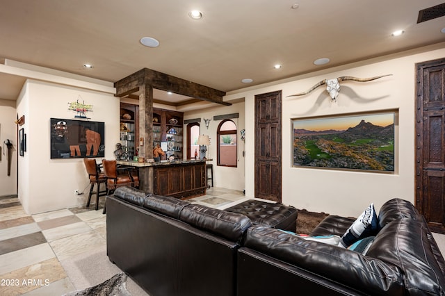 tiled living room featuring indoor bar