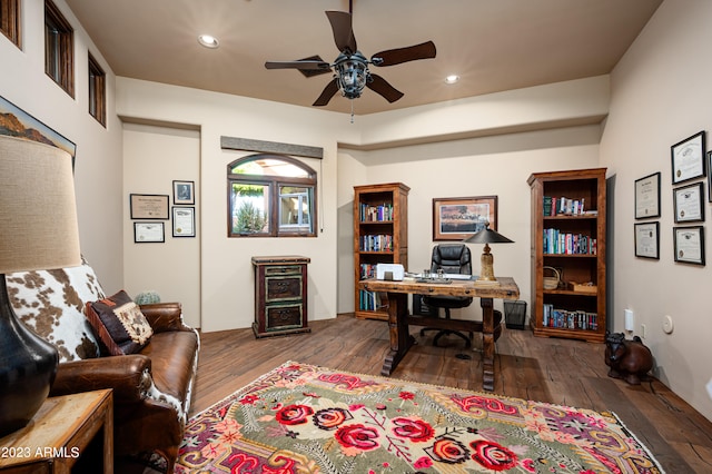 office space with dark hardwood / wood-style flooring and ceiling fan