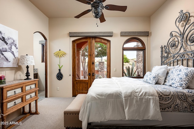 carpeted bedroom with ceiling fan, access to outside, and french doors