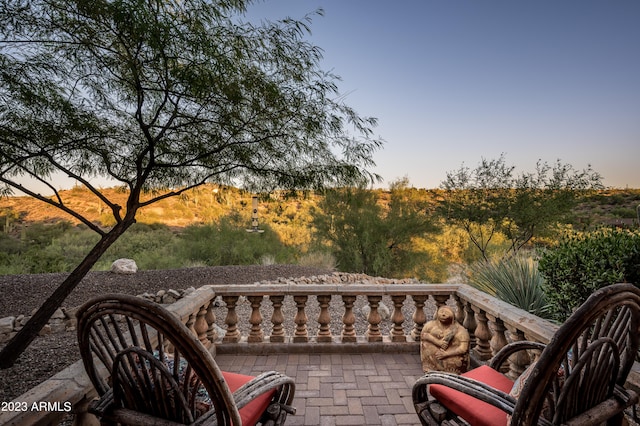 view of patio terrace at dusk