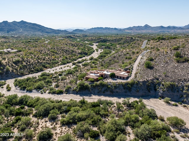 birds eye view of property with a mountain view