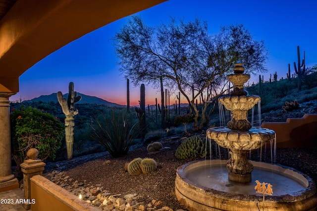 yard at dusk with a mountain view