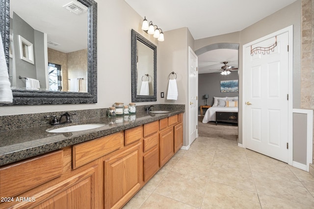 bathroom featuring ceiling fan, vanity, and tile patterned flooring