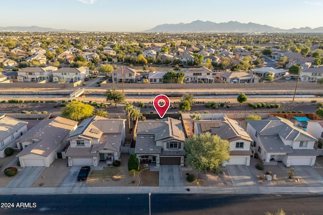 birds eye view of property with a mountain view