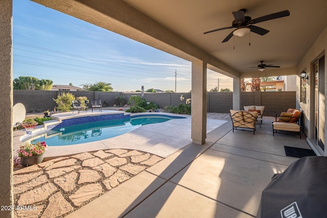 view of pool featuring ceiling fan and a patio