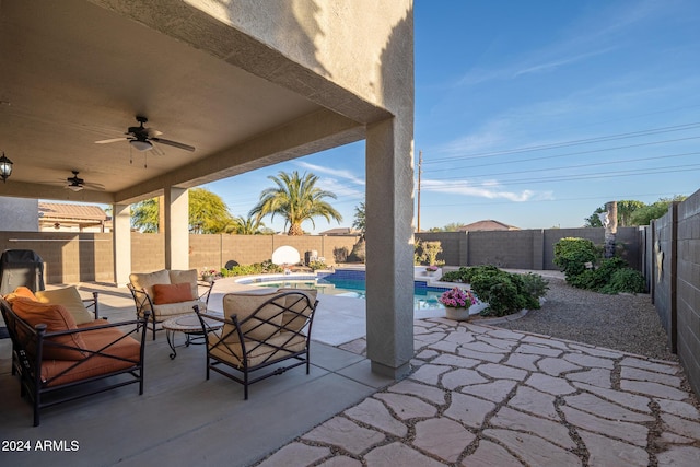 view of patio / terrace with an outdoor hangout area, ceiling fan, and a fenced in pool