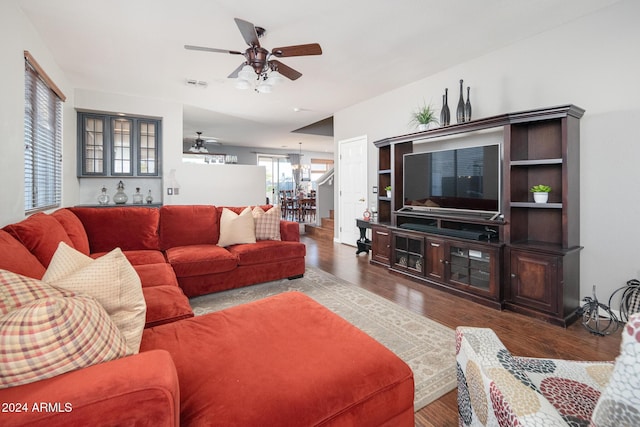 living room featuring ceiling fan and hardwood / wood-style flooring