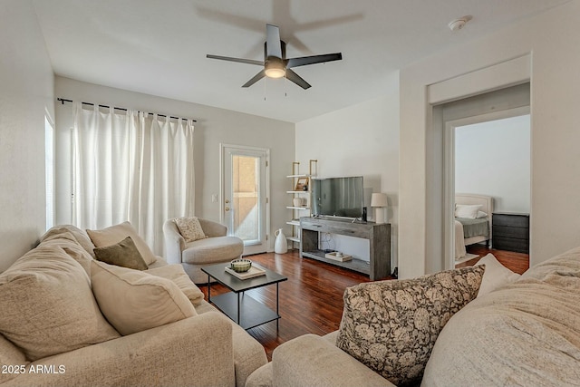 living area with ceiling fan and wood finished floors