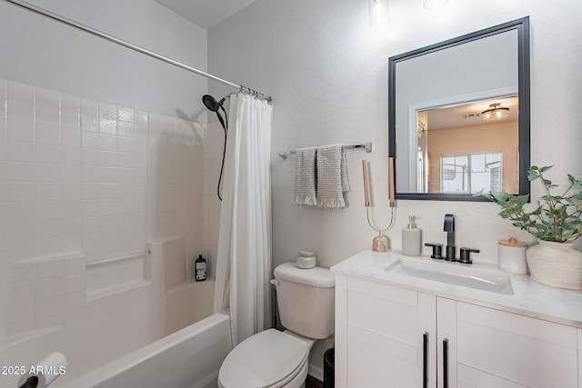 bathroom featuring toilet, shower / bath combo with shower curtain, and vanity