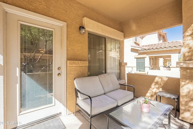 view of patio / terrace with a balcony