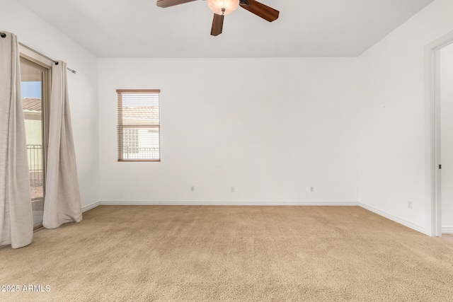 unfurnished room featuring light carpet and ceiling fan