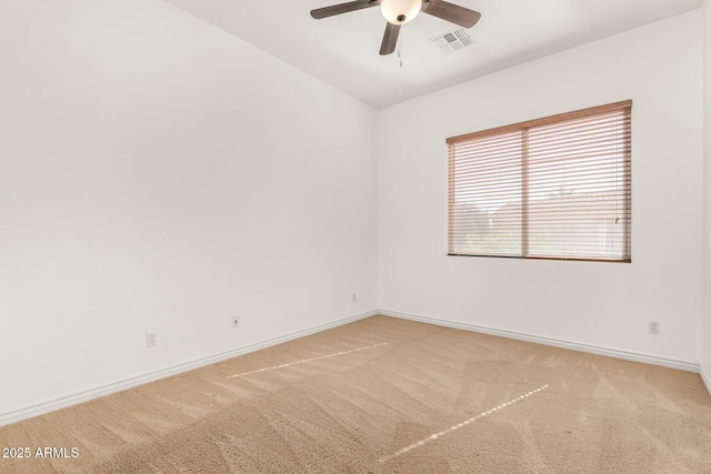 empty room with ceiling fan and carpet flooring