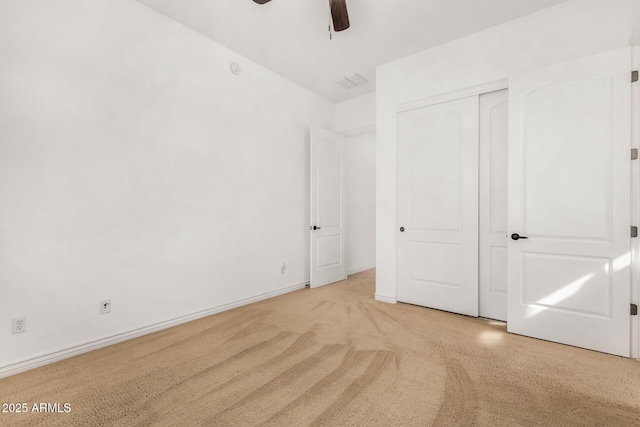 unfurnished bedroom featuring ceiling fan and a closet