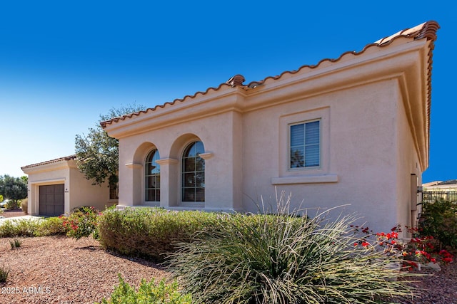 view of front of property with a garage