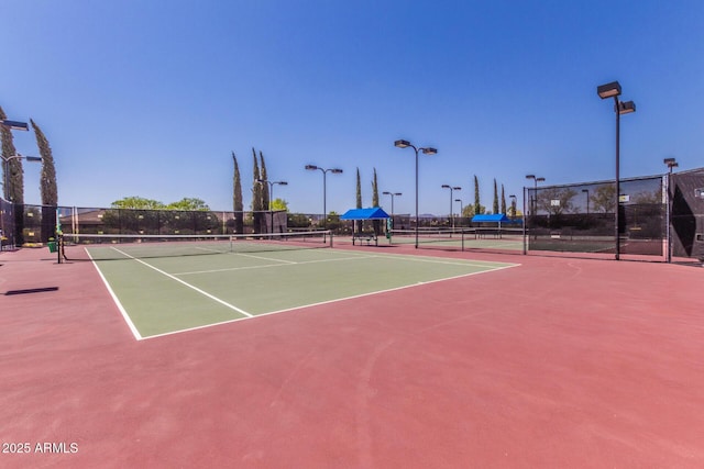 view of sport court with basketball hoop