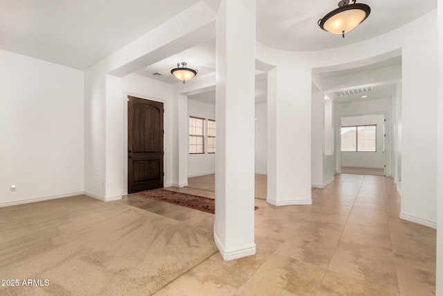 entryway with light colored carpet