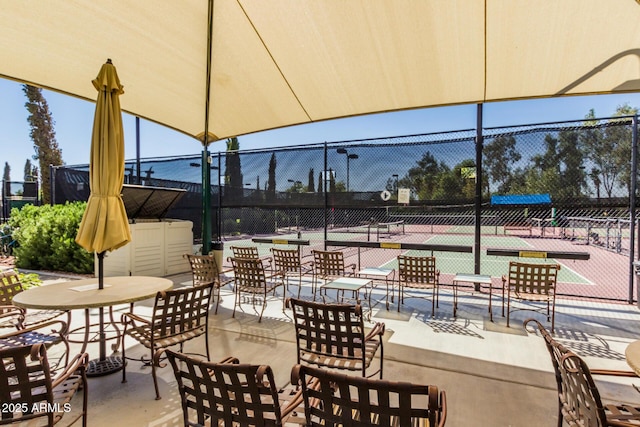 view of patio / terrace featuring tennis court