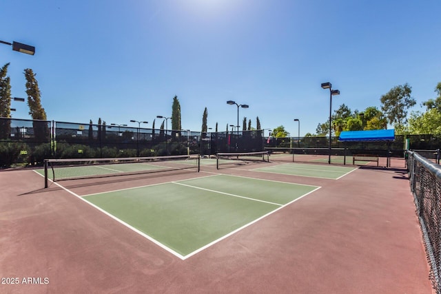 view of tennis court featuring basketball court