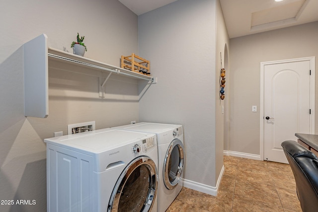 laundry area featuring washing machine and clothes dryer