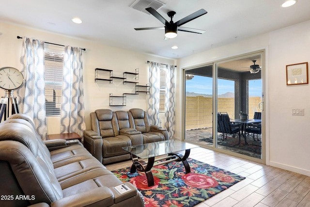 19560 W Valle Vista Way, Litchfield Park, AZ 85340 - living room featuring recessed lighting, wood finished floors, visible vents, baseboards, and ceiling fan