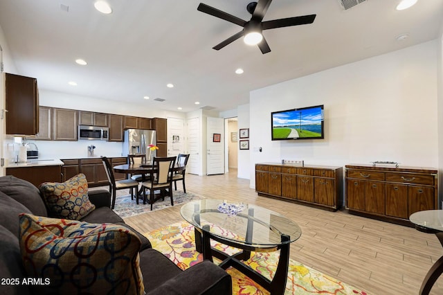 19560 W Valle Vista Way, Litchfield Park, AZ 85340 - living area featuring a ceiling fan, visible vents, recessed lighting, and light wood-style floors