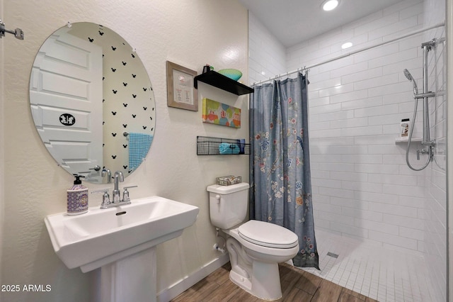 19560 W Valle Vista Way, Litchfield Park, AZ 85340 - full bath with a sink, wood finished floors, tiled shower, toilet, and recessed lighting