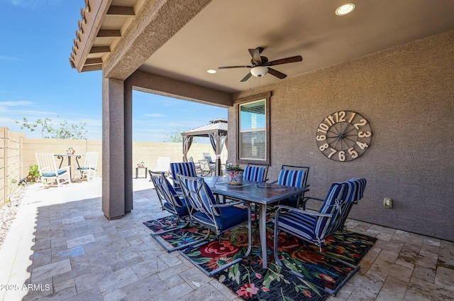 19560 W Valle Vista Way, Litchfield Park, AZ 85340 - view of patio with a fenced backyard, outdoor dining area, and ceiling fan