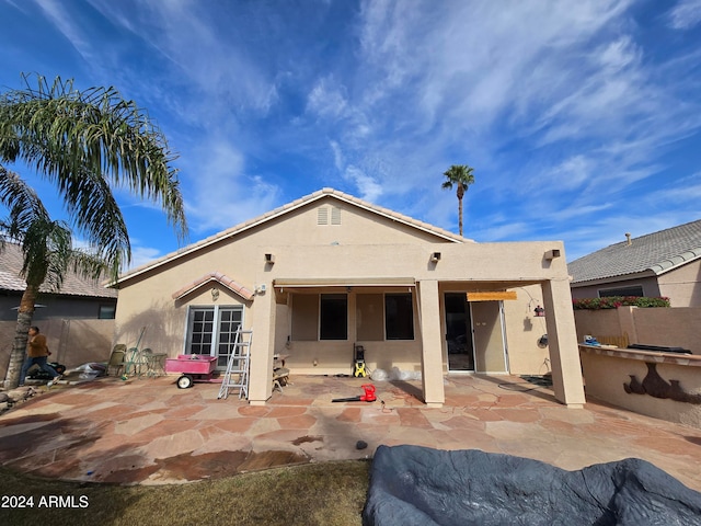 rear view of house featuring a patio