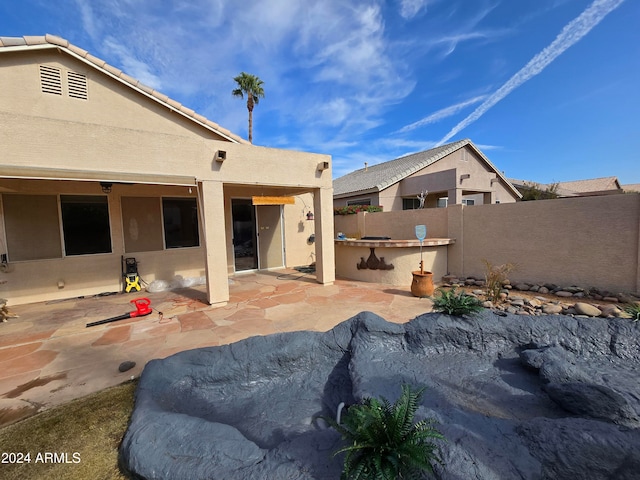 rear view of property with a patio area