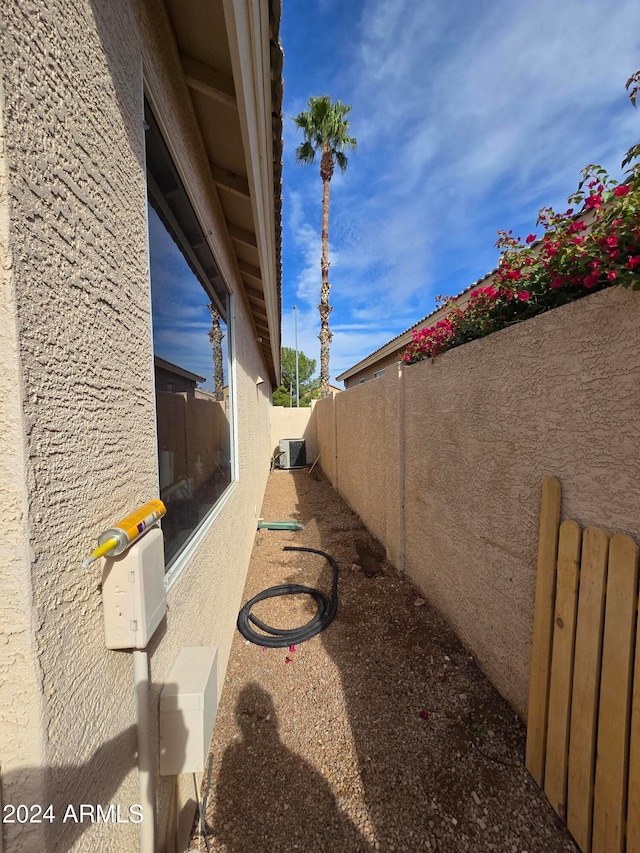 view of side of home featuring cooling unit