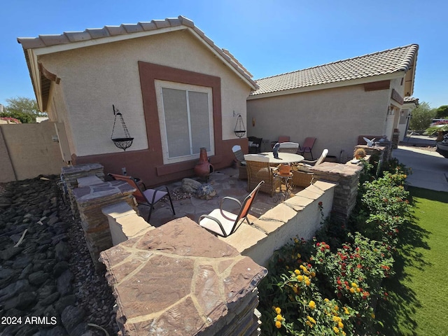 rear view of house featuring a patio area