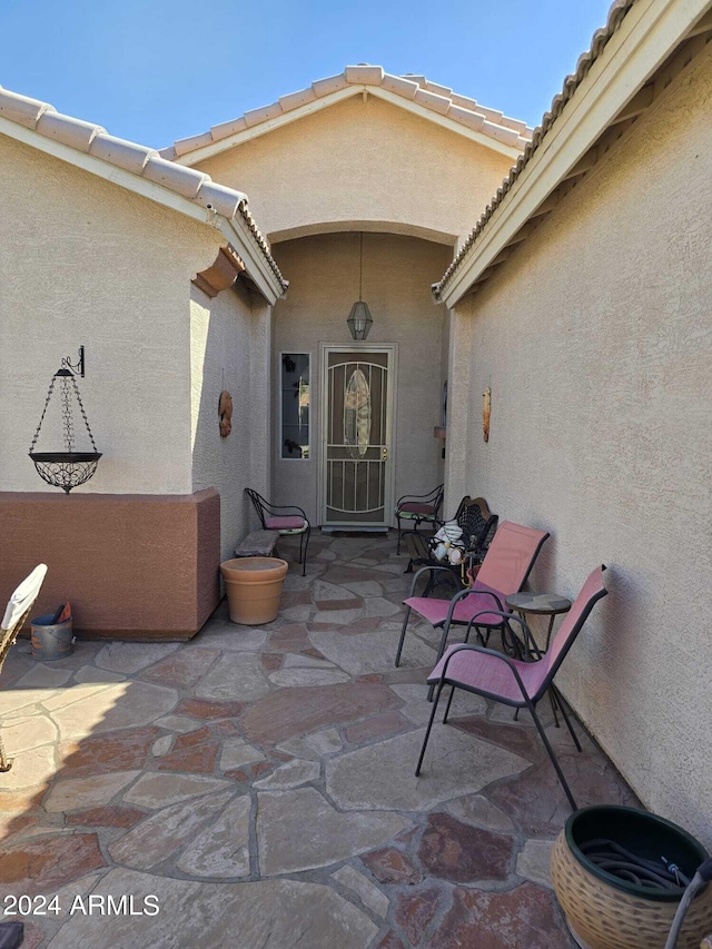 doorway to property with a patio