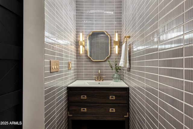 bathroom featuring tile walls and vanity