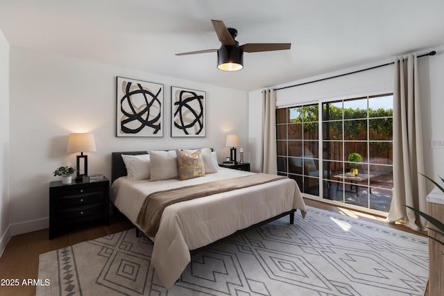 bedroom with baseboards, ceiling fan, access to exterior, and wood finished floors