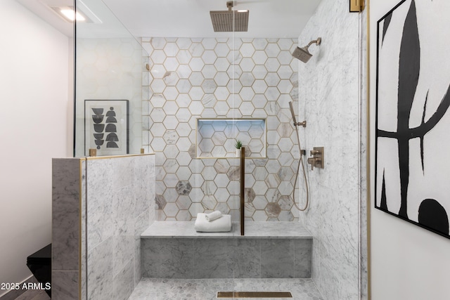 full bath with tiled shower