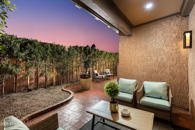view of patio terrace at dusk