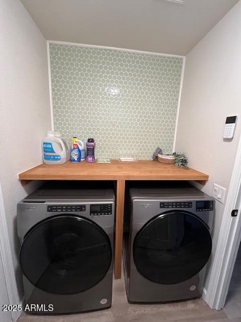 washroom with washer and clothes dryer