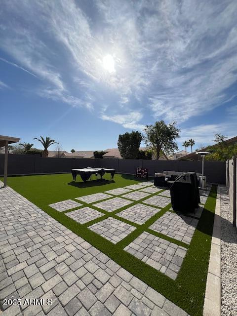 view of yard with a patio area