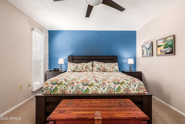 carpeted bedroom featuring a ceiling fan and baseboards