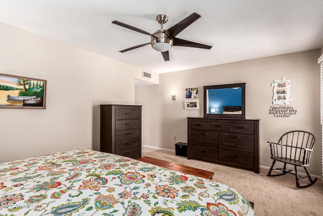 bedroom featuring visible vents, a ceiling fan, baseboards, and light carpet