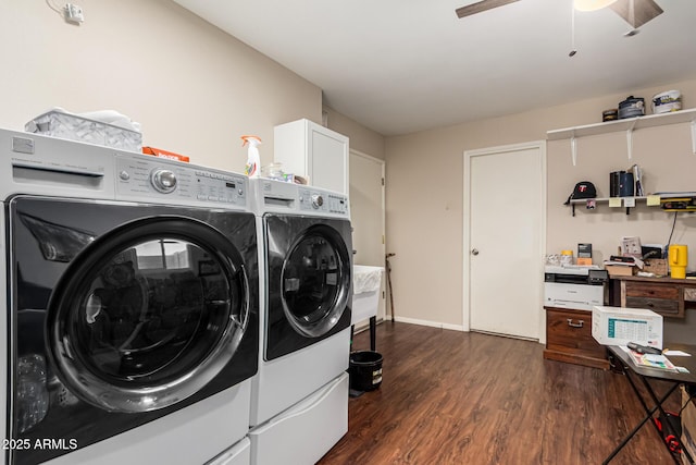 laundry room featuring washing machine and dryer, ceiling fan, baseboards, cabinet space, and dark wood-type flooring
