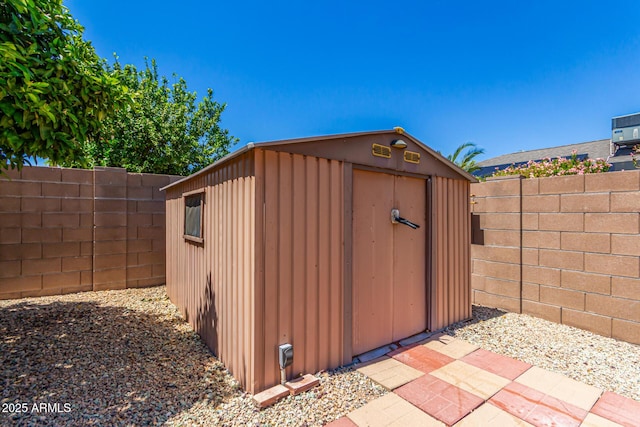view of shed featuring a fenced backyard