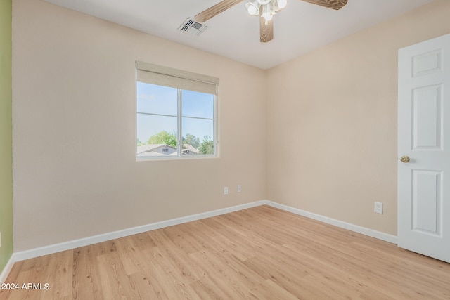 spare room with light hardwood / wood-style flooring and ceiling fan