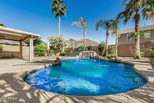 view of swimming pool featuring a patio area and pool water feature