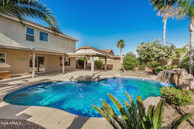 view of pool featuring a patio area and pool water feature