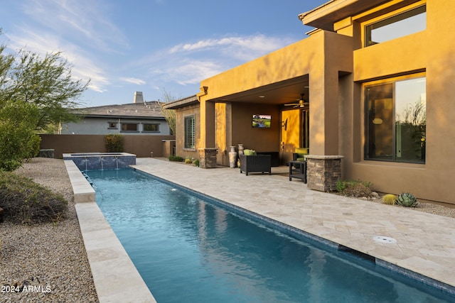 view of swimming pool with a patio area and ceiling fan