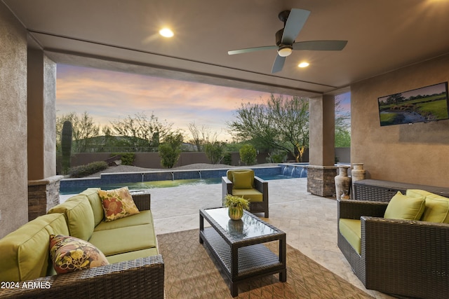 view of patio featuring pool water feature, ceiling fan, a fenced in pool, and an outdoor hangout area